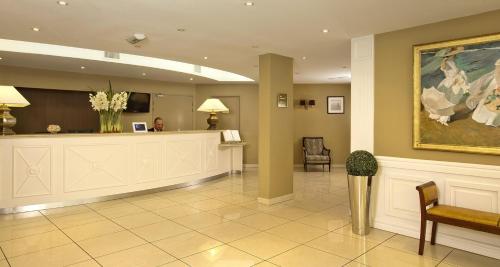 a lobby with a reception desk and a waiting room at Residhome Arcachon Plazza in Arcachon