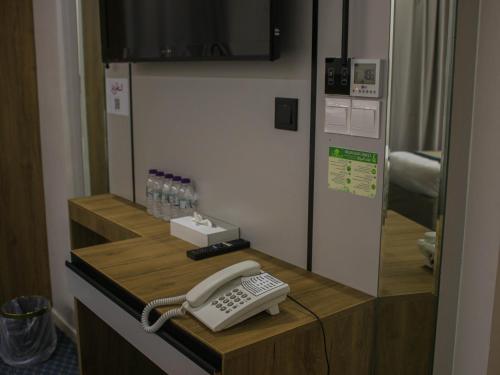 a phone sitting on a counter in a room at فندق برج جزيرة العرب in Medina