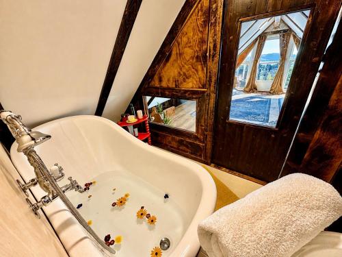 a bathroom with a tub with animals in it at Fjord Panorama Lodge in Strand