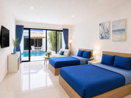 two beds in a room with a pool at Monalisa Blue haven pool hotel in Pattaya South
