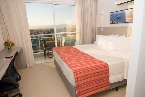 Katil atau katil-katil dalam bilik di Ramada by Wyndham Macae Hotel & Suites