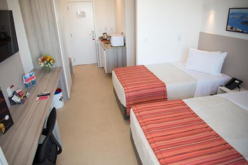 Katil atau katil-katil dalam bilik di Ramada by Wyndham Macae Hotel & Suites