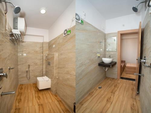 a bathroom with a shower and a sink at Devbhoomi Inn in Deoghar