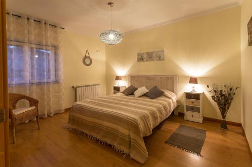 A bed or beds in a room at Casa da Póvoa