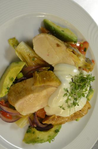 a white plate of food with vegetables on it at Hotel Spessartstuben in Haibach