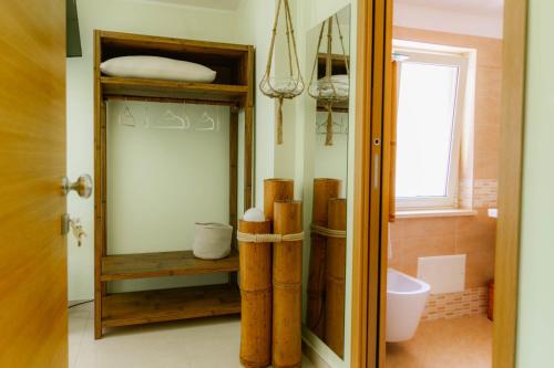 a bathroom with a sink and a toilet in a room at Oasi Scolacium in Villaggio Le Rocelle