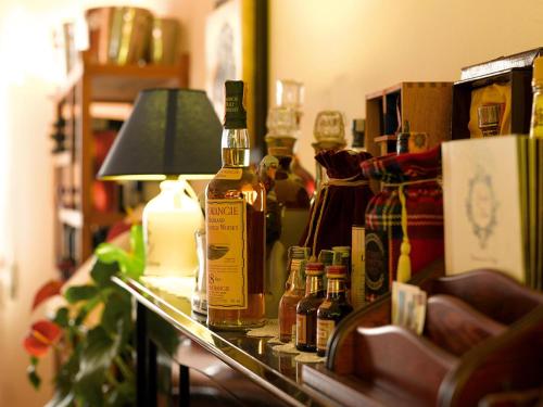 a group of bottles of alcohol on a table at Giorgio e Flora Ristorante e Locanda in Arsiero