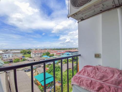 a balcony with a view of a city at Condo Tulip Square at Aomnoi in Ban Khlong Om Noi