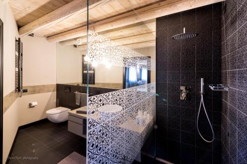 a bathroom with a shower with a glass door at Podere La Torre in Schio