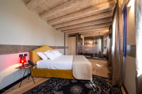 a bedroom with a large bed in a room at Podere La Torre in Schio
