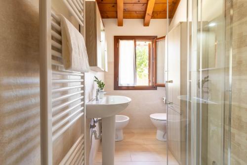 a bathroom with a sink and a toilet at TRAIN HOUSE in Treviso