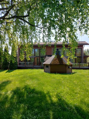 a house with a large yard in front of it at Kiurun Villas in Imatra
