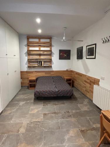 a bedroom with a large bed in a room at El balcó de la plaça de la font in Tarragona