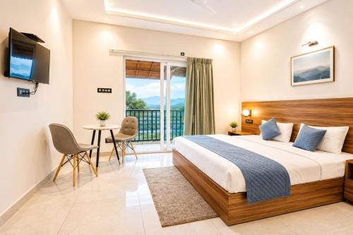 a hotel room with a bed and a balcony at Sanctuary Boutique Hotel in Bhīm Tāl