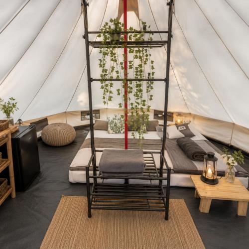 a room with a chair in a tent at Zimnik Camp in Lipowa