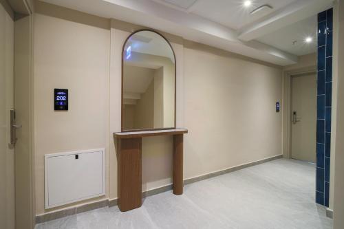 an empty hallway with a mirror on the wall at Stern Hotel Karaköy-Special Class in Istanbul