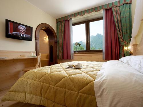 Katil atau katil-katil dalam bilik di Giorgio e Flora Ristorante e Locanda