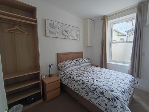 a bedroom with a bed and a window at The Loy Guest Apartment in Cookstown