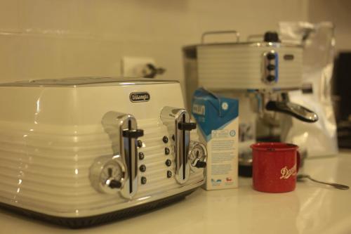 a white toaster sitting on top of a counter at NOT FOUND Hostel in Viña del Mar