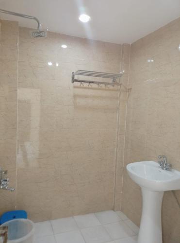a bathroom with a shower and a sink at Skoon b&b homestay in Shimla