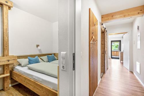 a bedroom with a bed and a hallway at Oberling in Herbrechtingen