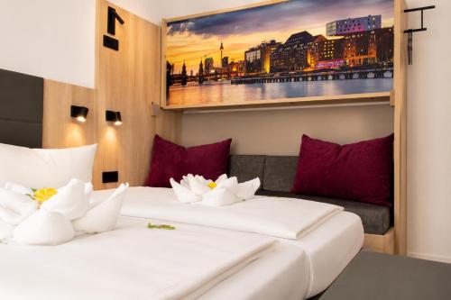Ліжко або ліжка в номері HOLI City Apart Hotel Berlin