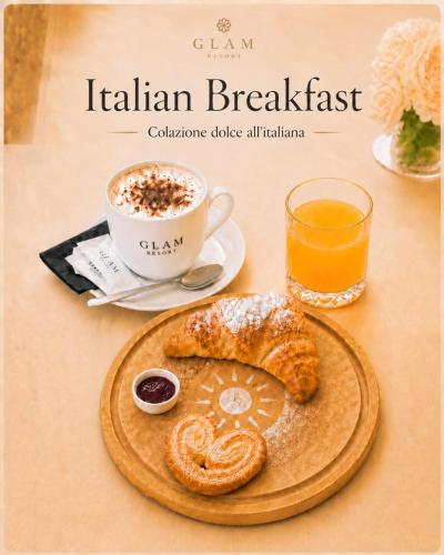a table with a plate of food and a cup of coffee at Dépendance du Glam Resort in La Spezia
