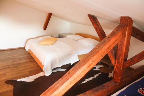 a bedroom with a bed in a attic at Apartmány Gulliver in Mikulov
