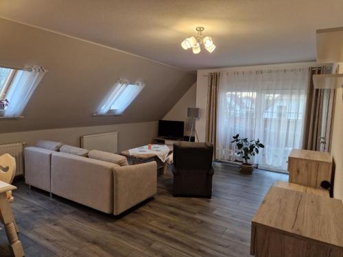 a living room with a couch and a table at Ferienwohnung Gretel in Görlitz
