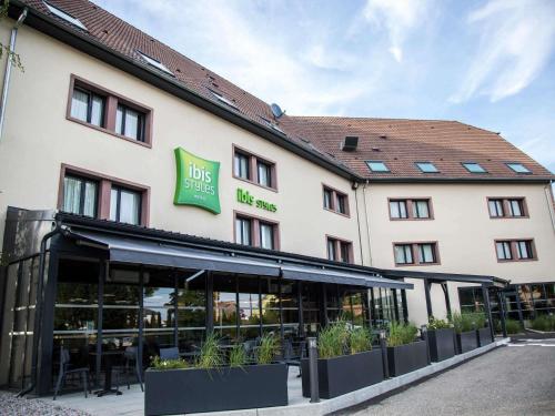 a hotel with a sign on the front of it at ibis Styles Bâle-Mulhouse Aéroport in Blotzheim