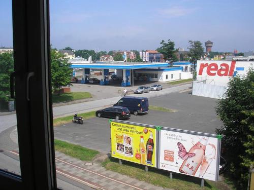 a view of a parking lot with a real gas station at Ferienwohnung Andy in Bremerhaven