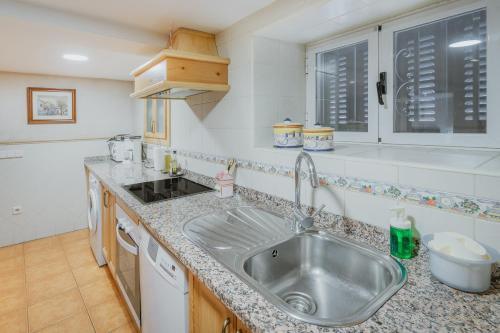 a kitchen with a sink and a counter top at Casa Romo 1 in Chavida