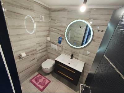 a bathroom with a sink and a mirror at Apartman Florida ranč in Doboj