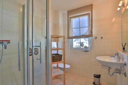 a bathroom with a shower and a sink and a toilet at Gesine 4 Mare Baltic in Nienhagen
