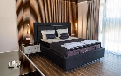 a bedroom with a large bed in a room at Luxe 1 apartments in Obzor