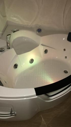 a white bath tub sitting in a room at Casa20 in Cisternino