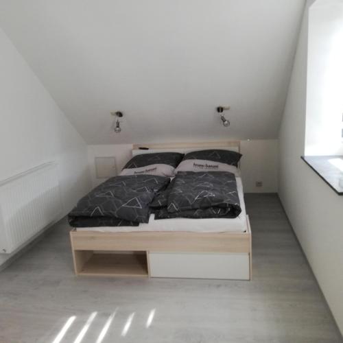 a bedroom with a bed in a small room at Wittenburg Perdöhl 2 in Wittenburg