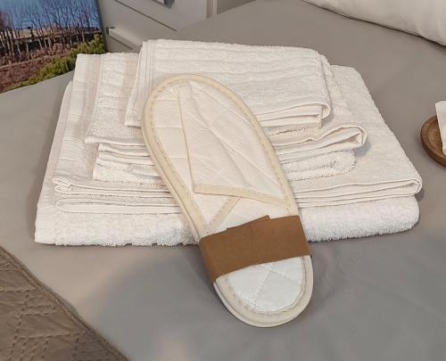 a pile of towels sitting next to a pile of towels at Franciacorta White in Cellatica