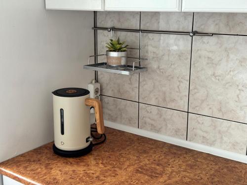 a coffee maker on a counter in a kitchen at Home4you Katowice, Free Parking, Self Check-in in Katowice