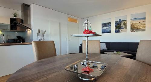 a wooden table in a kitchen with a dining room at Warnemünde Meeresrauschen 21707 in Warnemünde
