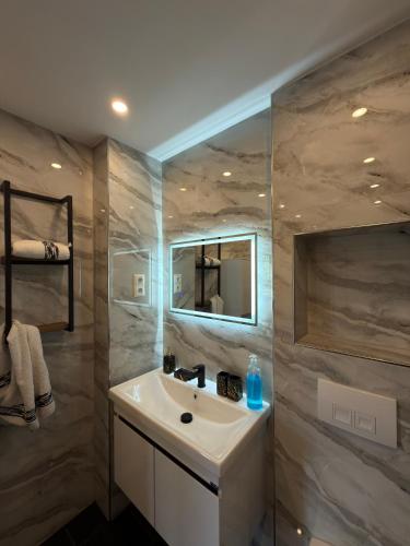 a bathroom with a sink and a mirror at Main Panorama Suite 97896 Freudenberg in Freudenberg am Main