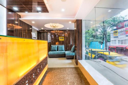 a lobby with a view of a store window at FabHotel Crown Heights - Nr Koramangala Club in Bangalore