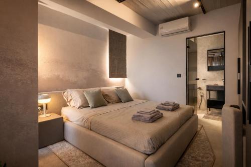 a bedroom with a large bed in a room at Nerea Residences in Schinias