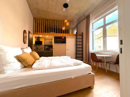 a bedroom with a large bed in a room at Villa Weitmar - Apartments und Private Spa in Bochum