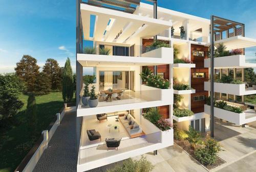 an aerial view of a white apartment building at Lago Suites in Paralimni