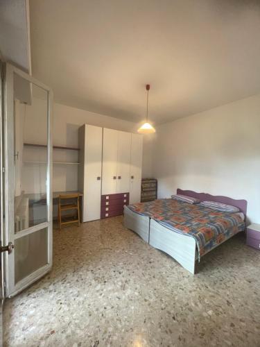a large bedroom with a bed and a closet at Casa vacanza Dominga in Marotta