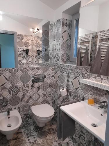 a bathroom with a toilet and a sink at Home Lotus Flower in Labin