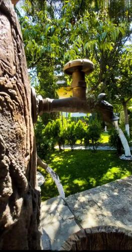 a water fountain in a park with a park at Guest House Simon Green in Balchik