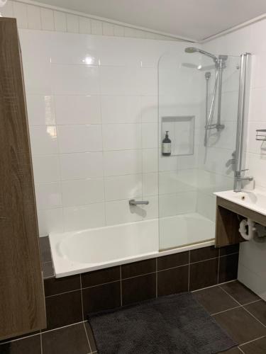 a bathroom with a shower and a sink at Kinnoull in Brisbane
