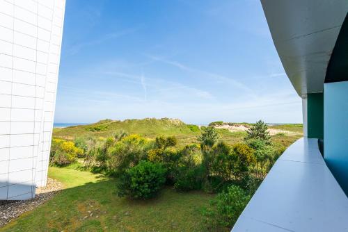 a view of the ocean from the balcony of a house at Salinas Surf Paradise in Salinas
